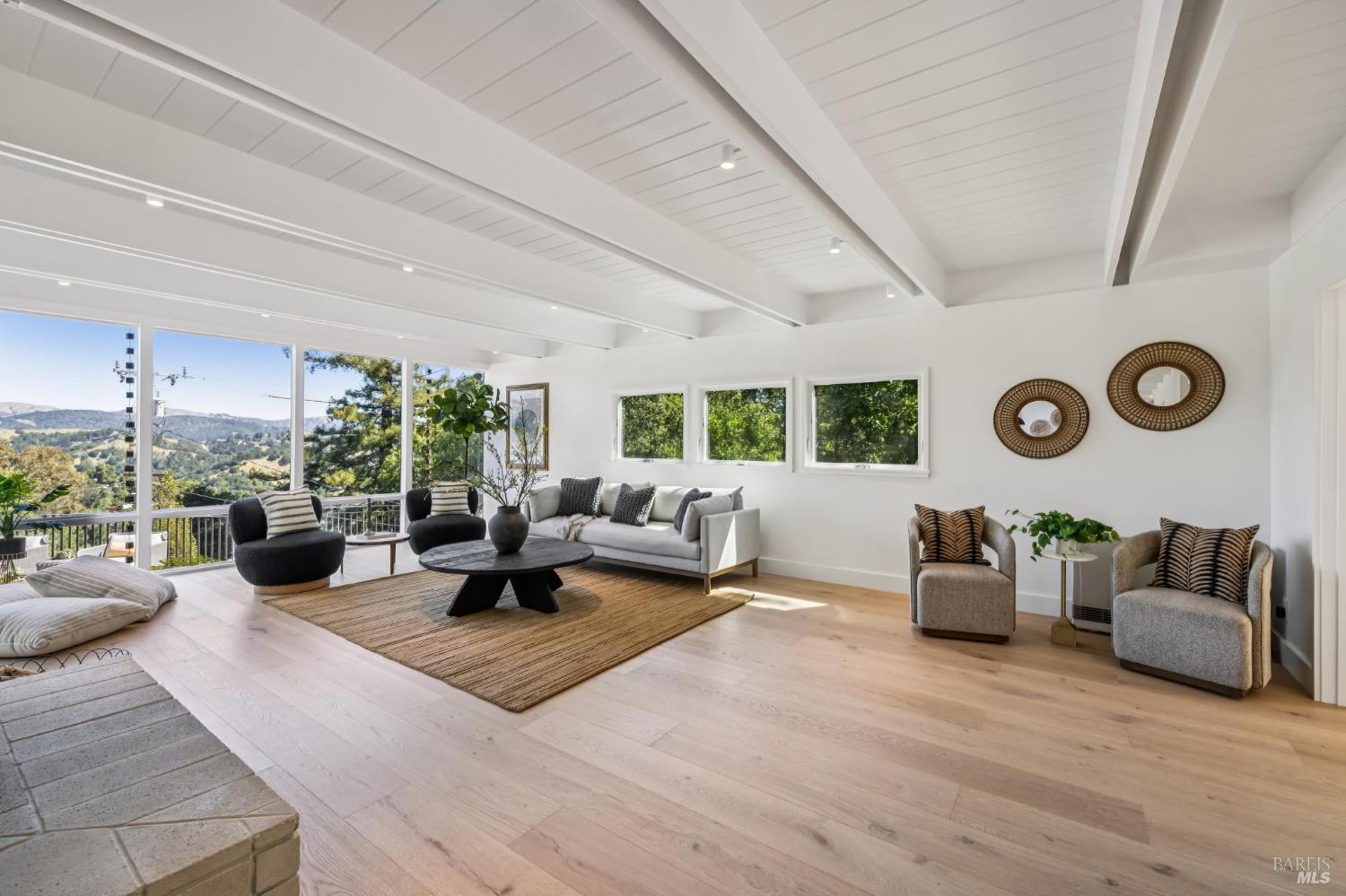485 Scenic Road Fairfax, CA 94930 - Photo 16 of 75 a living room with furniture and a large window
