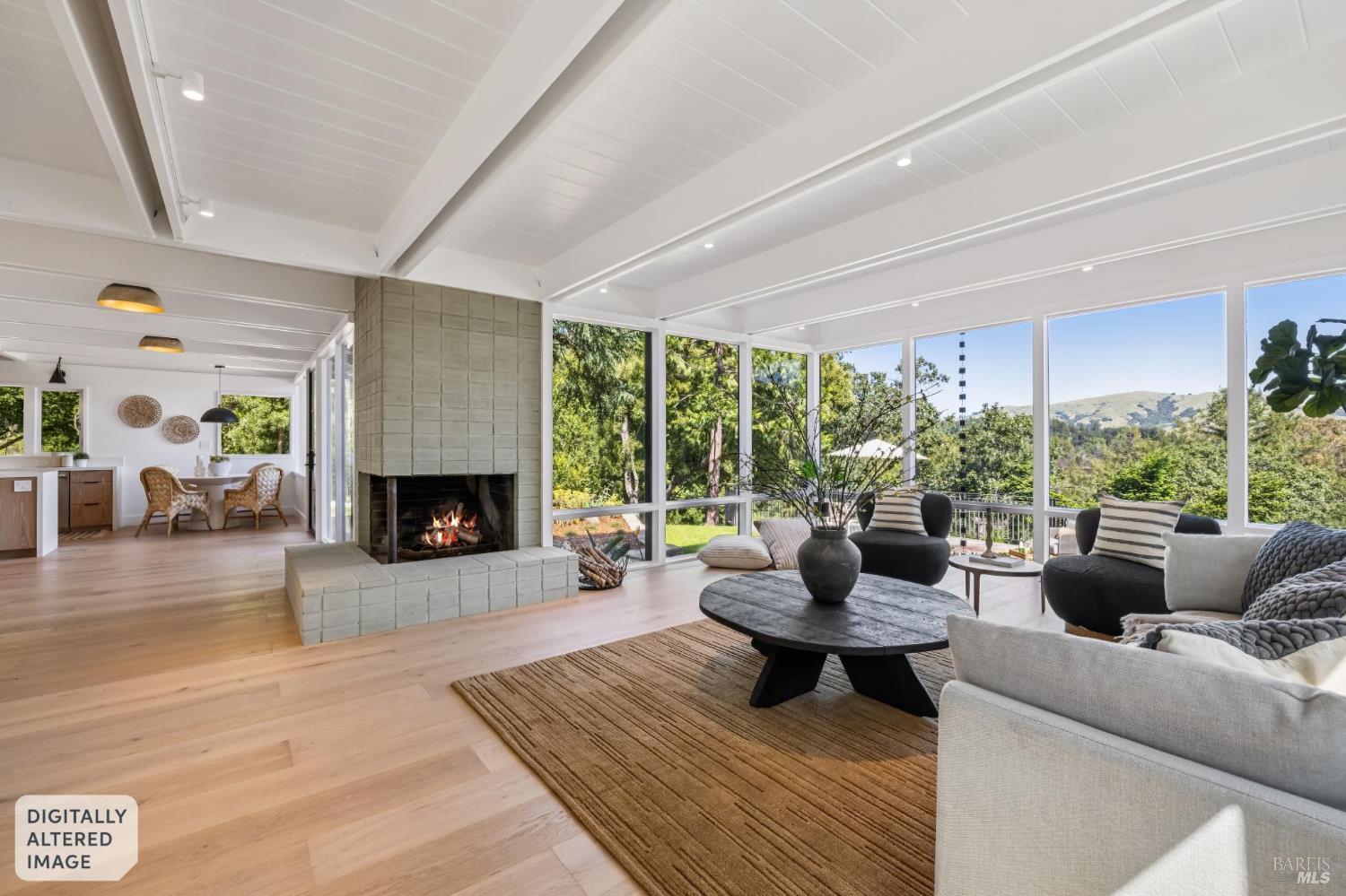 485 Scenic Road Fairfax, CA 94930 - Photo 23 of 75 a living room with furniture and a fireplace