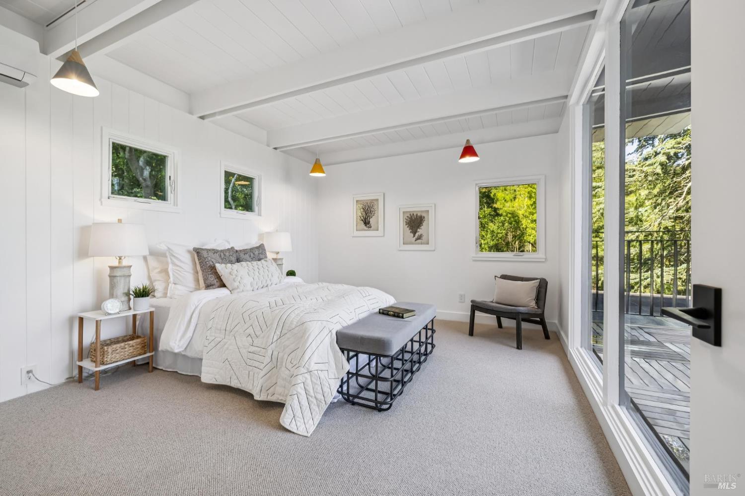 485 Scenic Road Fairfax, CA 94930 - Photo 58 of 75 a spacious bedroom with a bed and a table