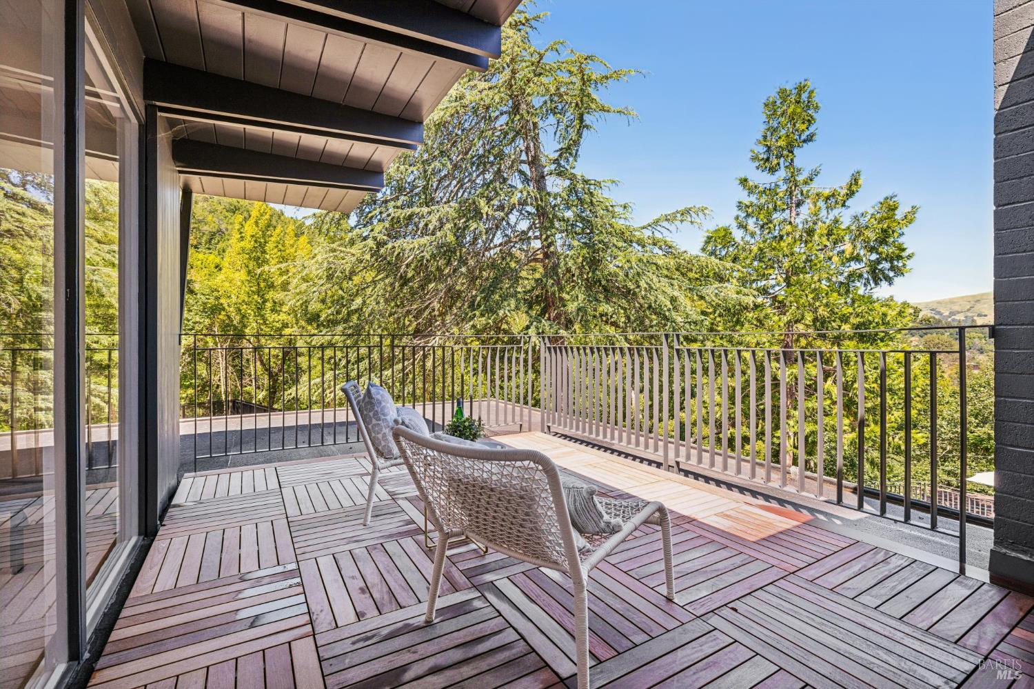 485 Scenic Road Fairfax, CA 94930 - Photo 61 of 75 a view of a balcony with chair and wooden floor