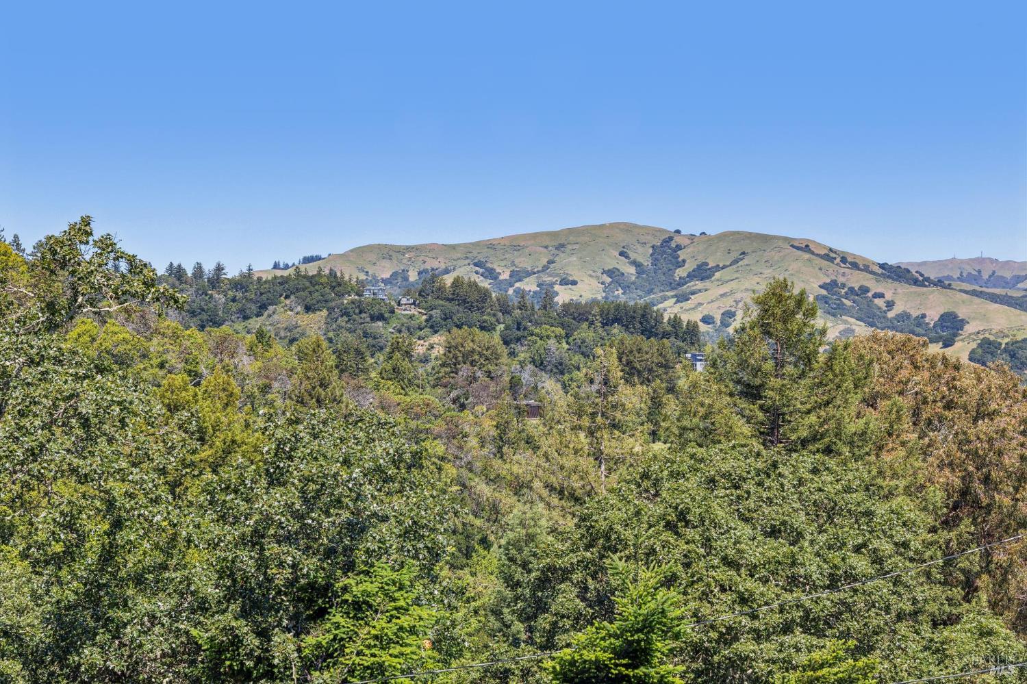 485 Scenic Road Fairfax, CA 94930 - Photo 66 of 75 a view of a large mountain with mountains in the background