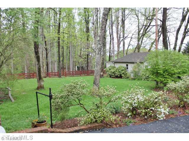 313 Deadmon Road Mocksville, NC 27028 - Photo 3 of 16 Land/Lot. Back yard that lead to the fenced in area and tractor shed