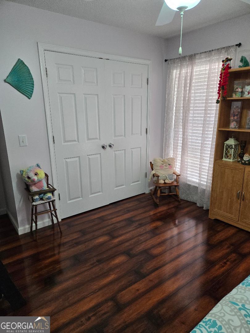 5002 Addison Trail Statesboro, GA 30458 - Photo 23 of 35 a view of a room with wooden floor and furniture