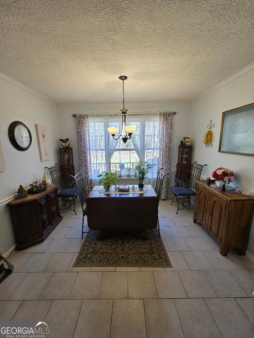 5002 Addison Trail Statesboro, GA 30458 - Photo 10 of 35 a living room with furniture and a chandelier