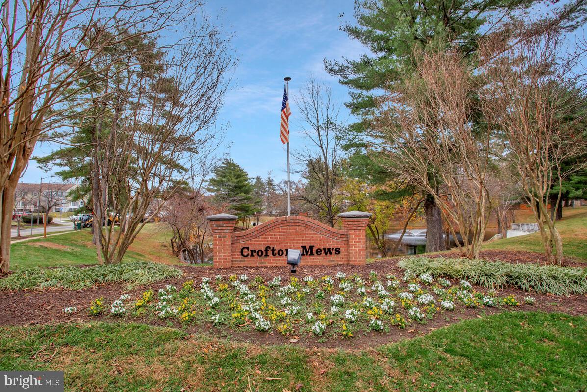 1438 Orleans Court Crofton, MD 21114 - Photo 2 of 26 a front view of a house with a yard