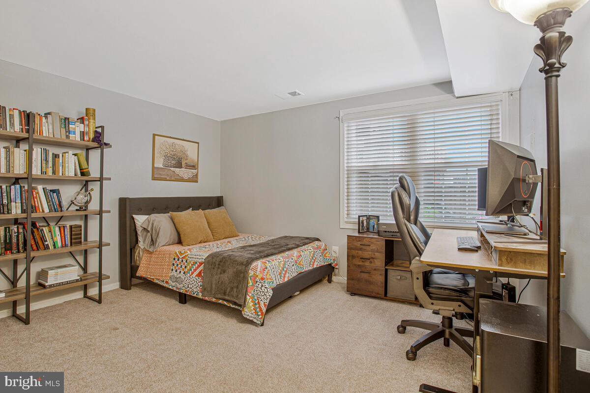 1438 Orleans Court Crofton, MD 21114 - Photo 23 of 26 a bedroom with a workspace