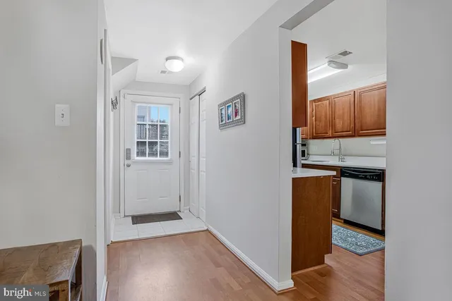 a view of kitchen with furniture and wooden floor