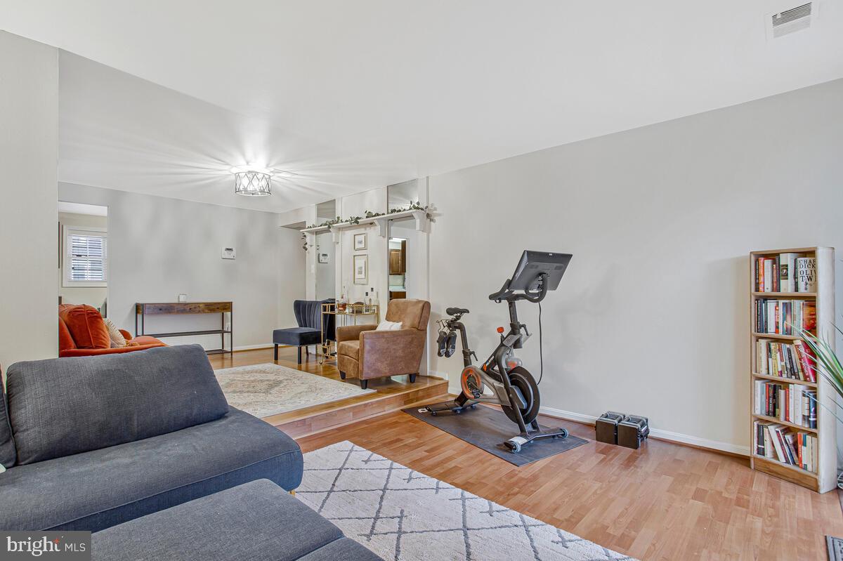 1438 Orleans Court Crofton, MD 21114 - Photo 7 of 26 a view of a livingroom with workspace and a window