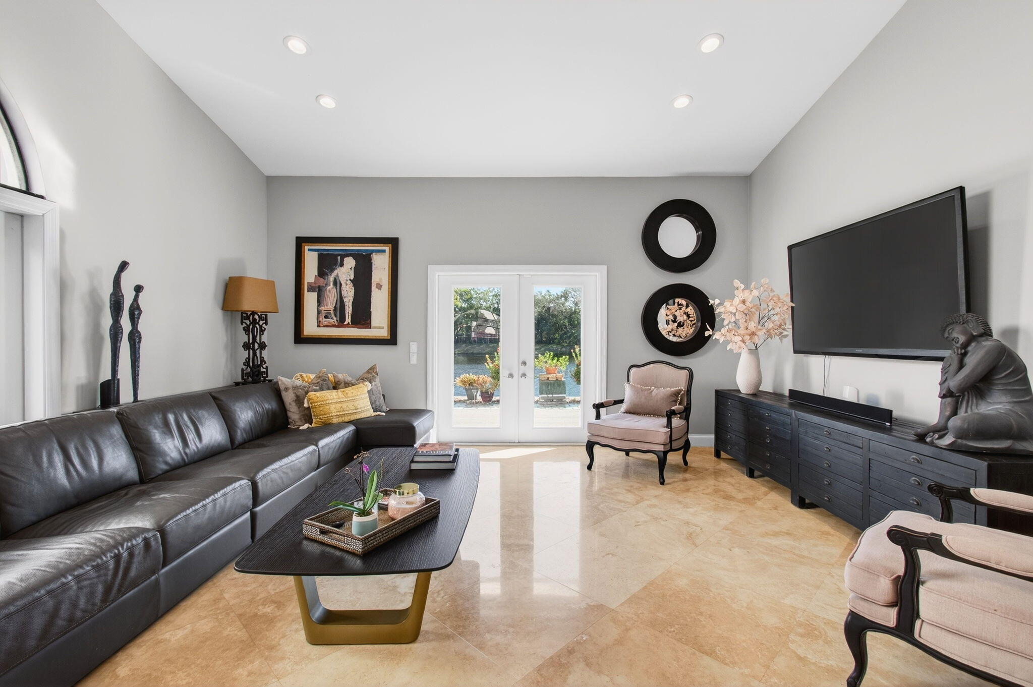 23145 Via Stel Boca Raton, FL 33433 - Photo 11 of 72 a living room with furniture a rug and a flat screen tv