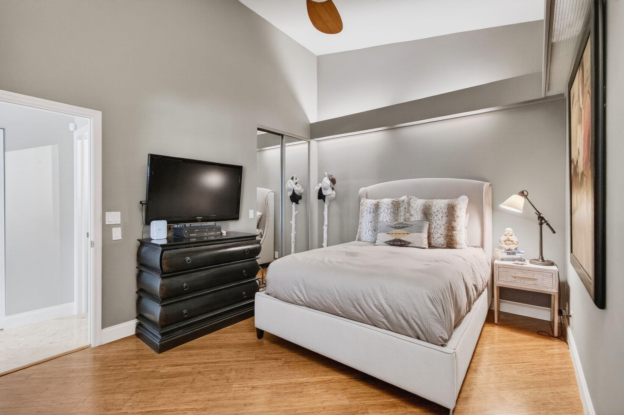 23145 Via Stel Boca Raton, FL 33433 - Photo 31 of 72 a bedroom with a bed and a flat screen tv