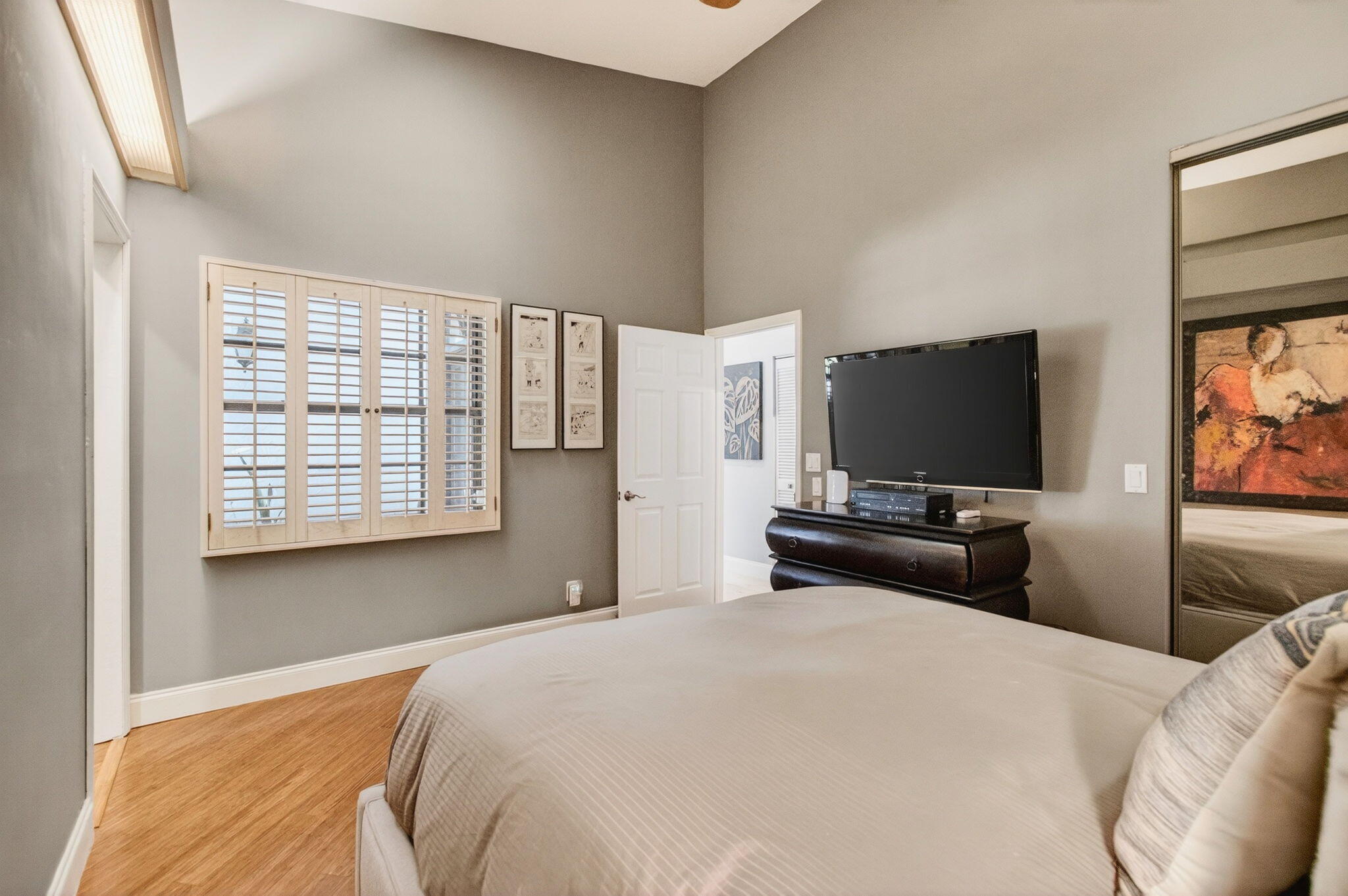 23145 Via Stel Boca Raton, FL 33433 - Photo 33 of 72 a bedroom with a bed and a flat screen tv