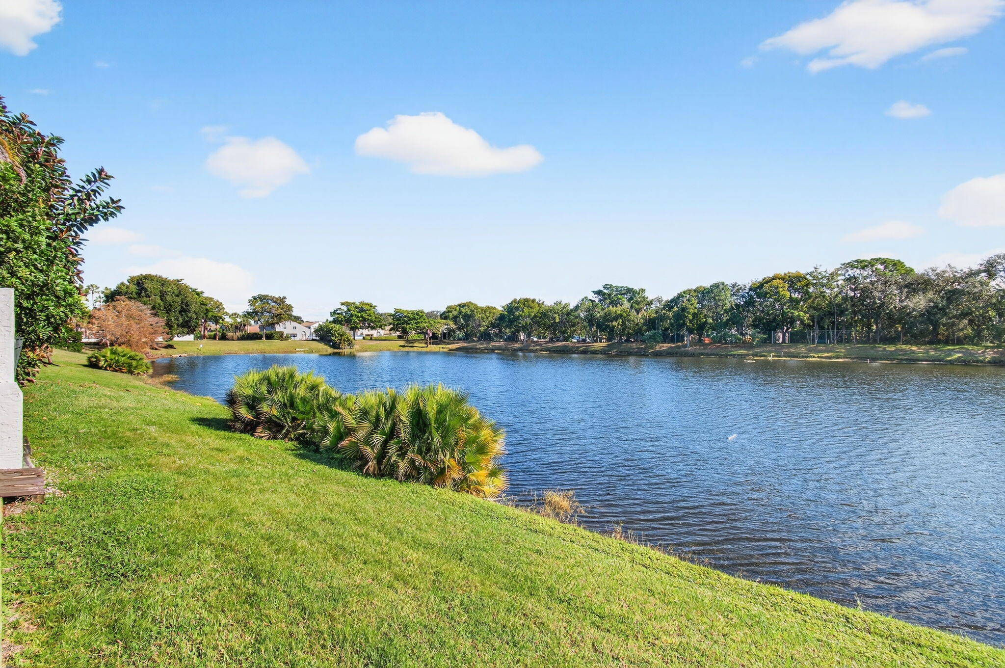 23145 Via Stel Boca Raton, FL 33433 - Photo 4 of 72 a view of a lake with houses in the back