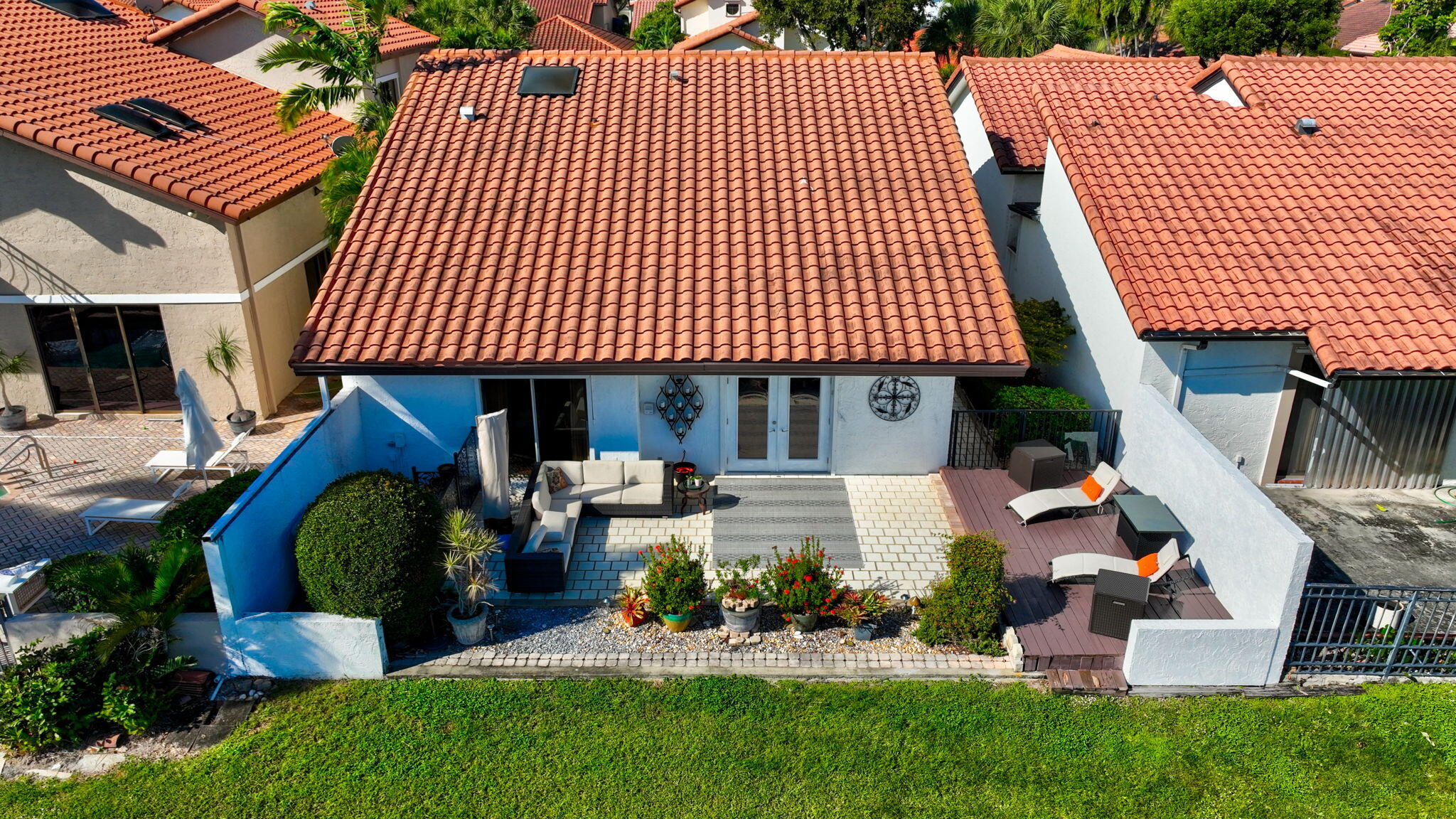 23145 Via Stel Boca Raton, FL 33433 - Photo 47 of 72 a front view of a house with a garden