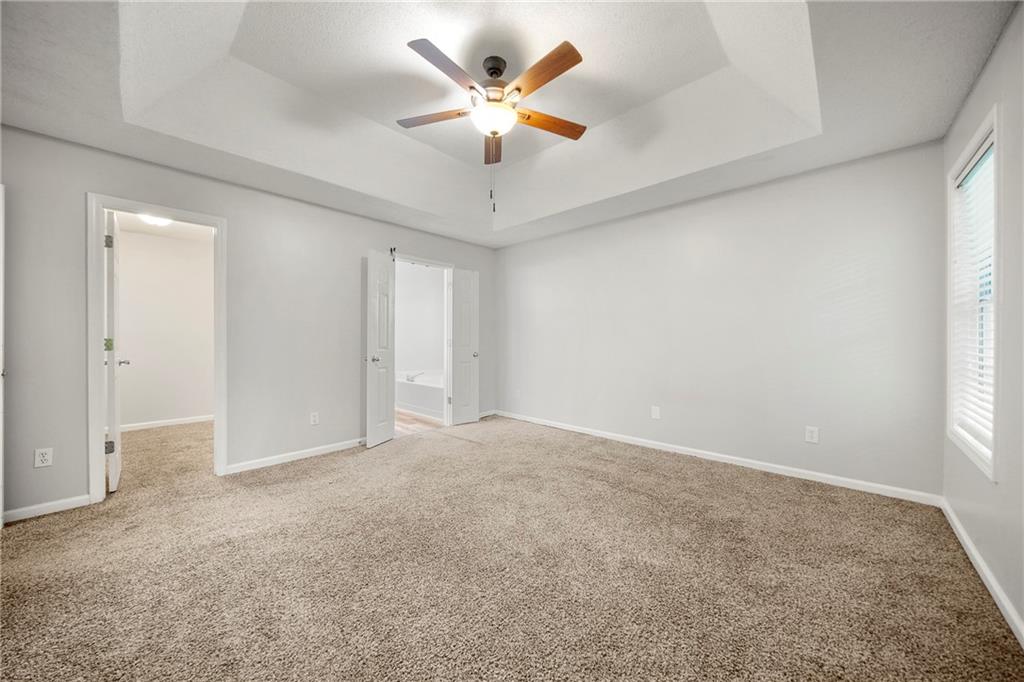 4317 Chesapeake Trace Acworth, GA 30101 - Photo 12 of 22 an empty room with closet and a ceiling fan
