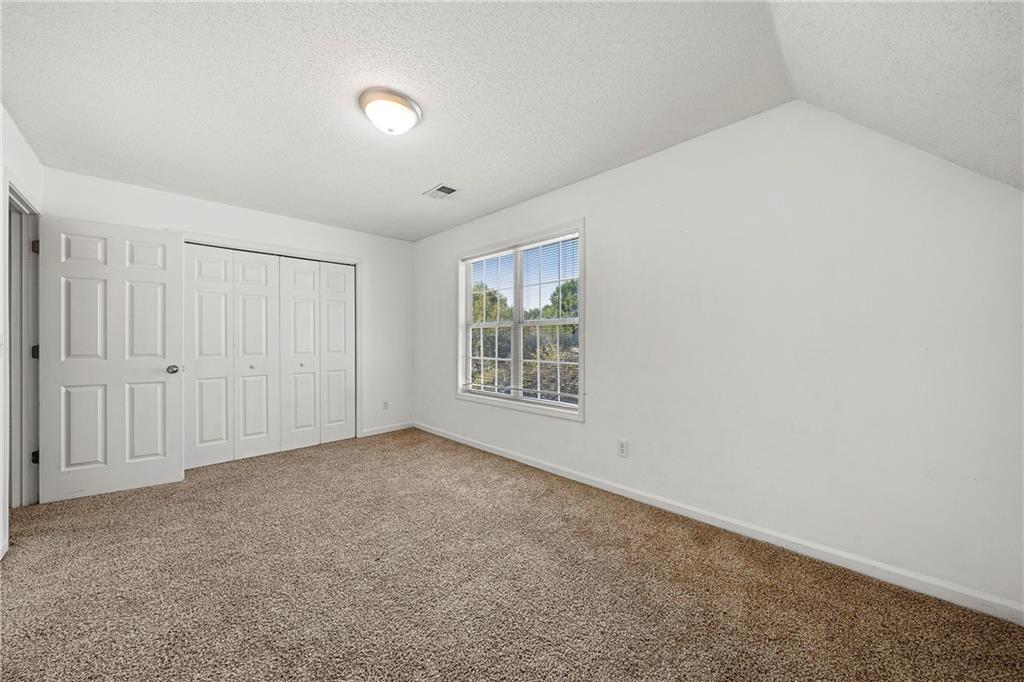 4317 Chesapeake Trace Acworth, GA 30101 - Photo 18 of 22 a view of an empty room with a window