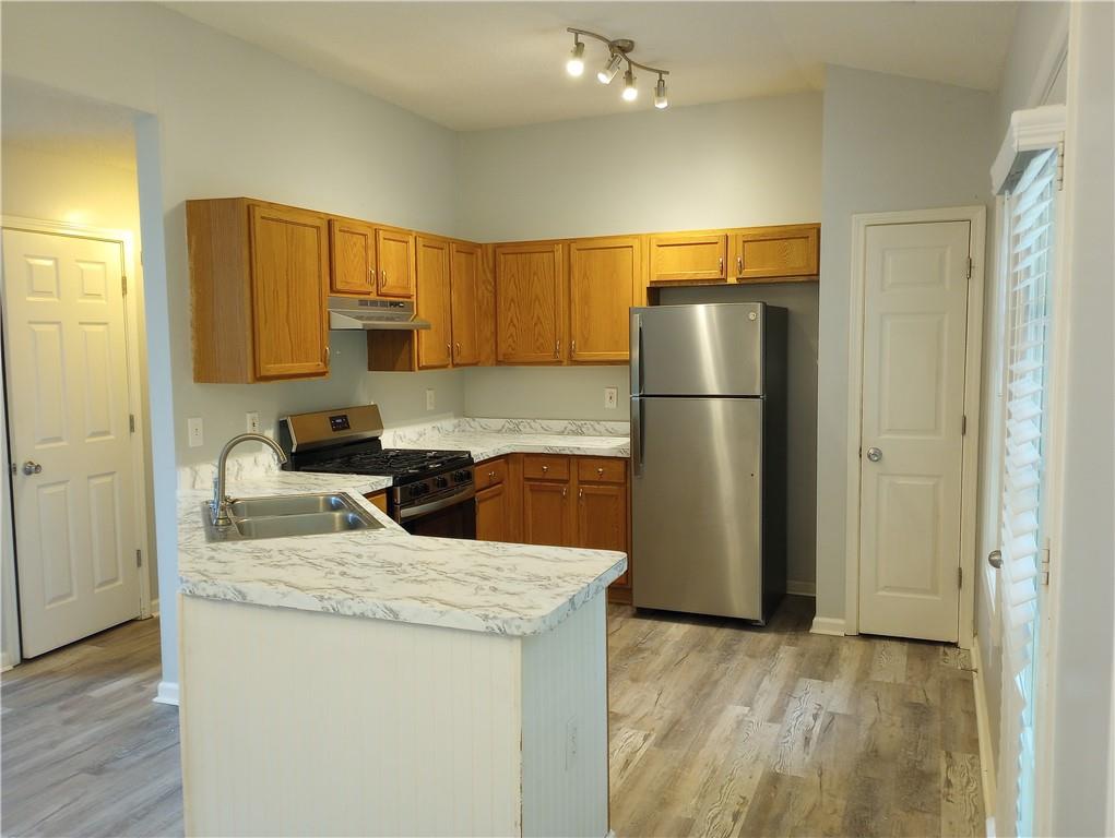 4317 Chesapeake Trace Acworth, GA 30101 - Photo 2 of 22 a kitchen with a refrigerator sink and stove