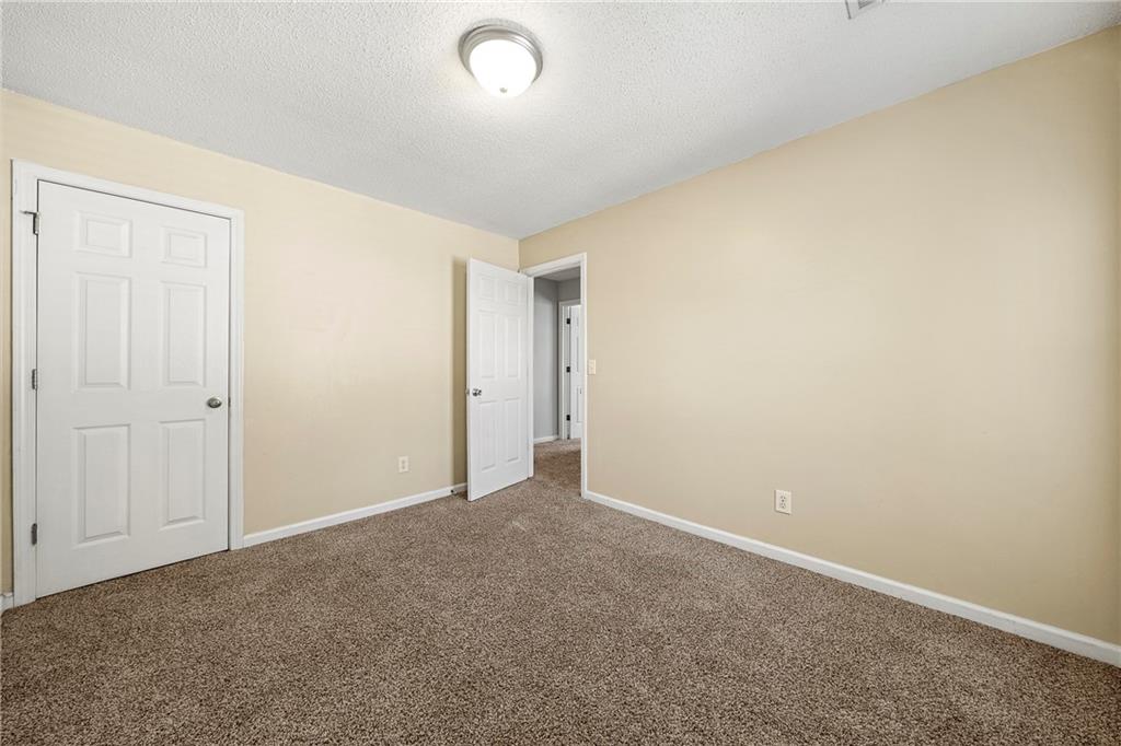 4317 Chesapeake Trace Acworth, GA 30101 - Photo 21 of 22 an empty room with an entryway