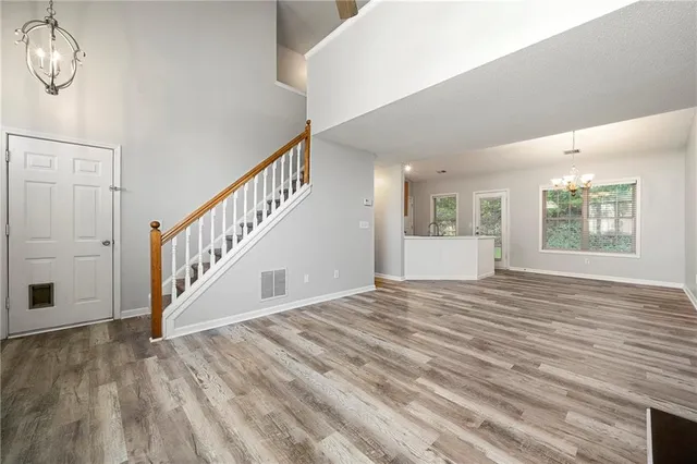 a view of an entryway with wooden floor