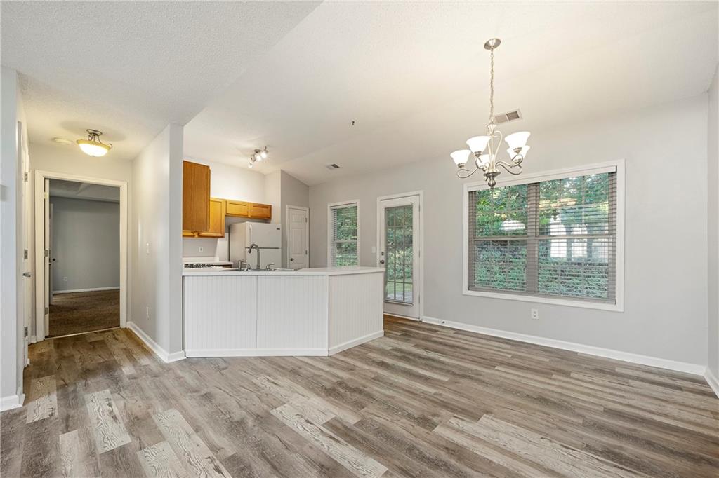 4317 Chesapeake Trace Acworth, GA 30101 - Photo 8 of 22 a view of a room with kitchen and window
