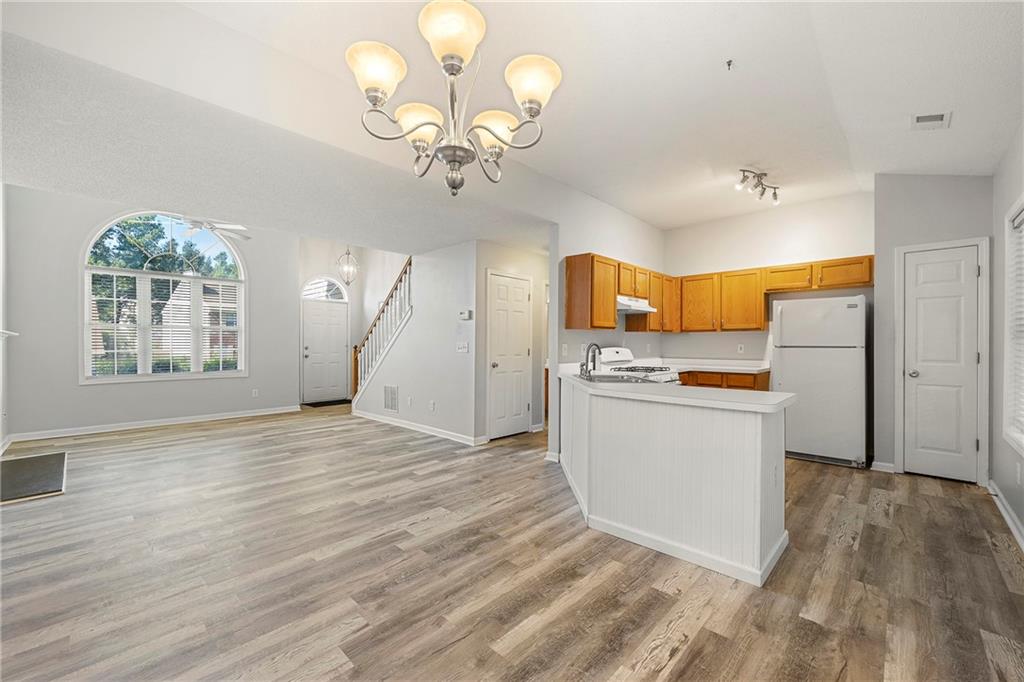 4317 Chesapeake Trace Acworth, GA 30101 - Photo 9 of 22 a view of a kitchen with wooden floor and electronic appliances