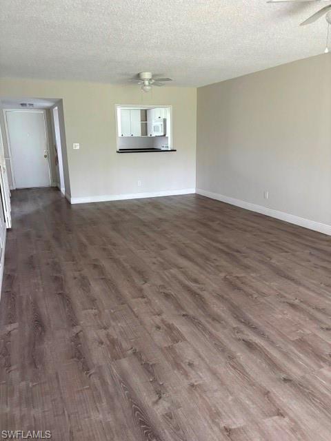 5651 Rattlesnake Hammock Road, Unit C108 Naples, FL 34113 - Photo 7 of 14 a view of empty room with wooden floor