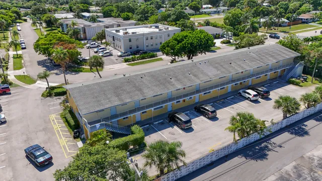 an aerial view of a house with outdoor space