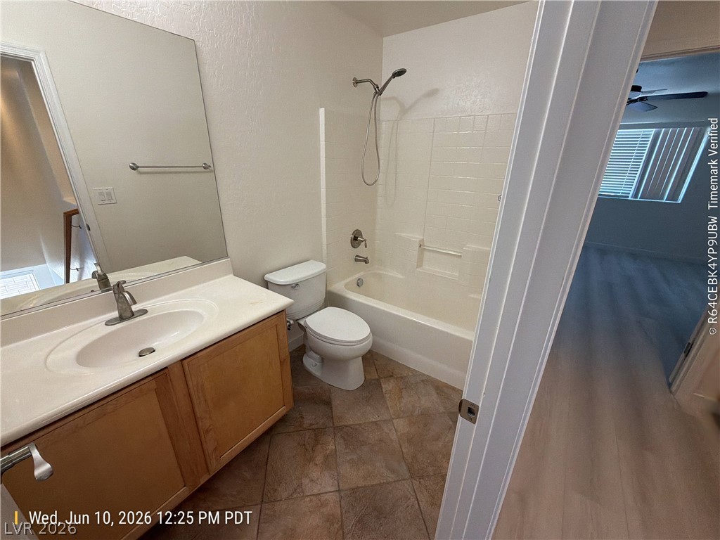 2388 Rue Bienville Way Henderson, NV 89044 - Photo 12 of 16 A well-maintained bathroom with a spacious vanity and combination tub-shower.