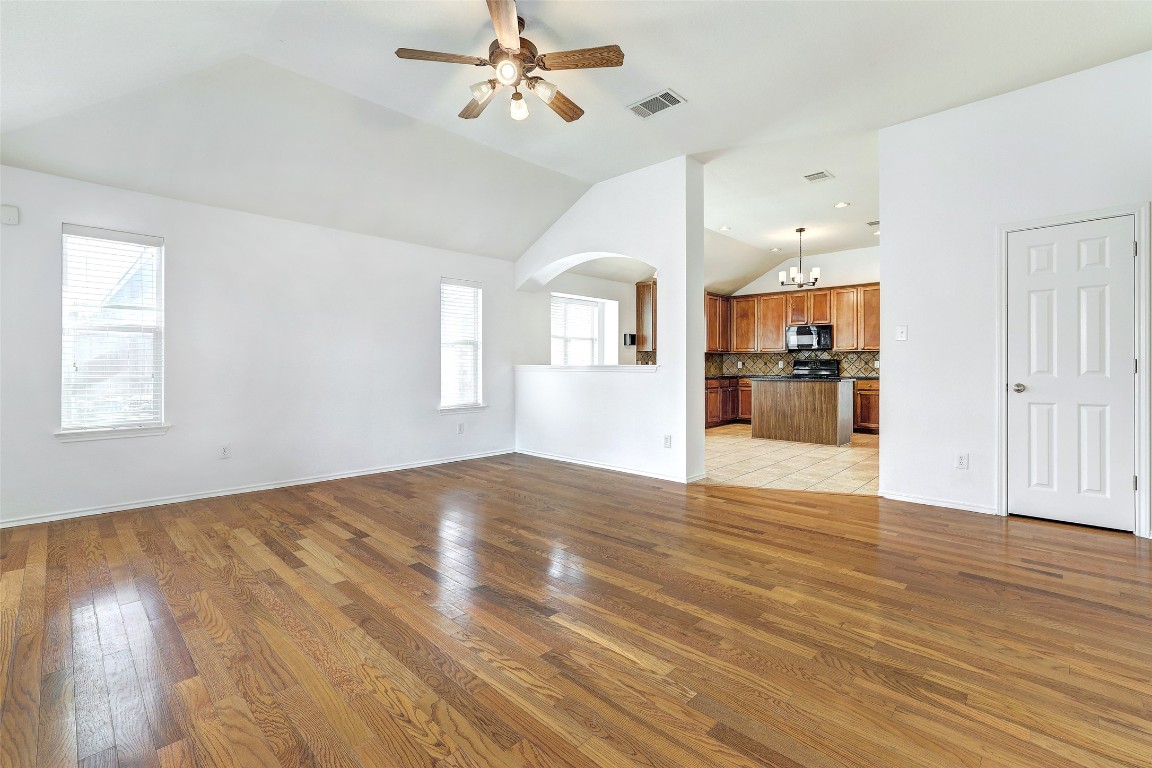 1517 Rainbow Parke Drive Round Rock, TX 78665 - Photo 19 of 38 a view of empty room with wooden floor and ceiling fan