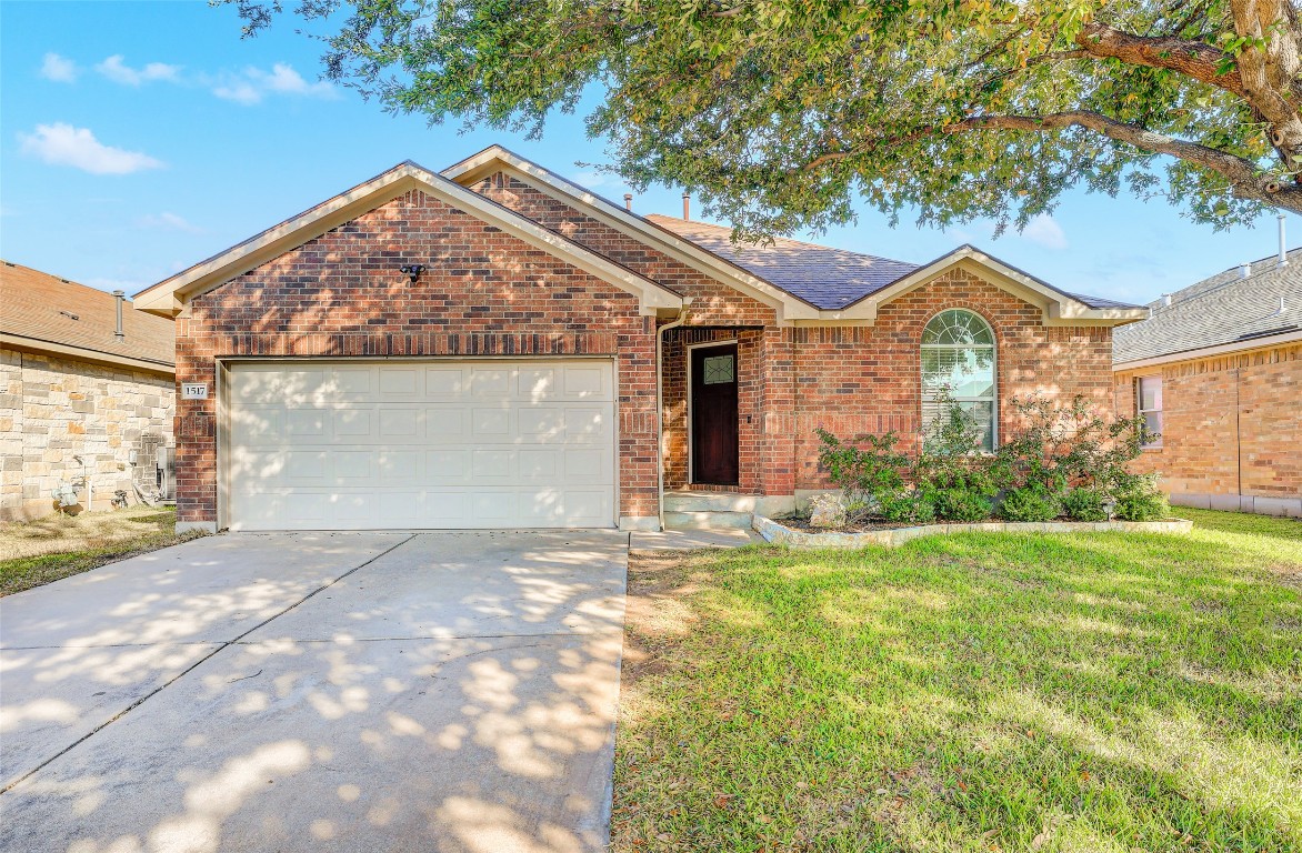 1517 Rainbow Parke Drive Round Rock, TX 78665 - Photo 2 of 38 a front view of a house with a yard and garage