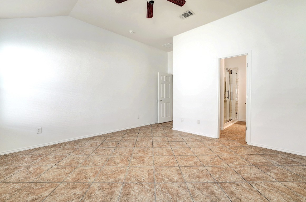1517 Rainbow Parke Drive Round Rock, TX 78665 - Photo 22 of 38 an empty room with a ceiling fan