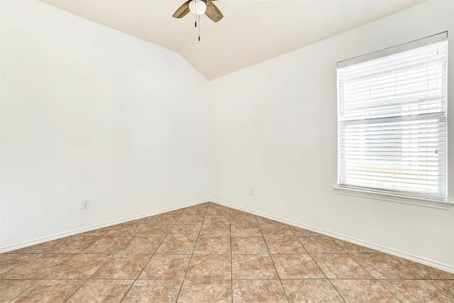a view of empty room with windows