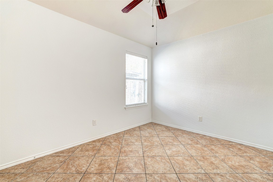1517 Rainbow Parke Drive Round Rock, TX 78665 - Photo 29 of 38 an empty room with a window and a ceiling fan