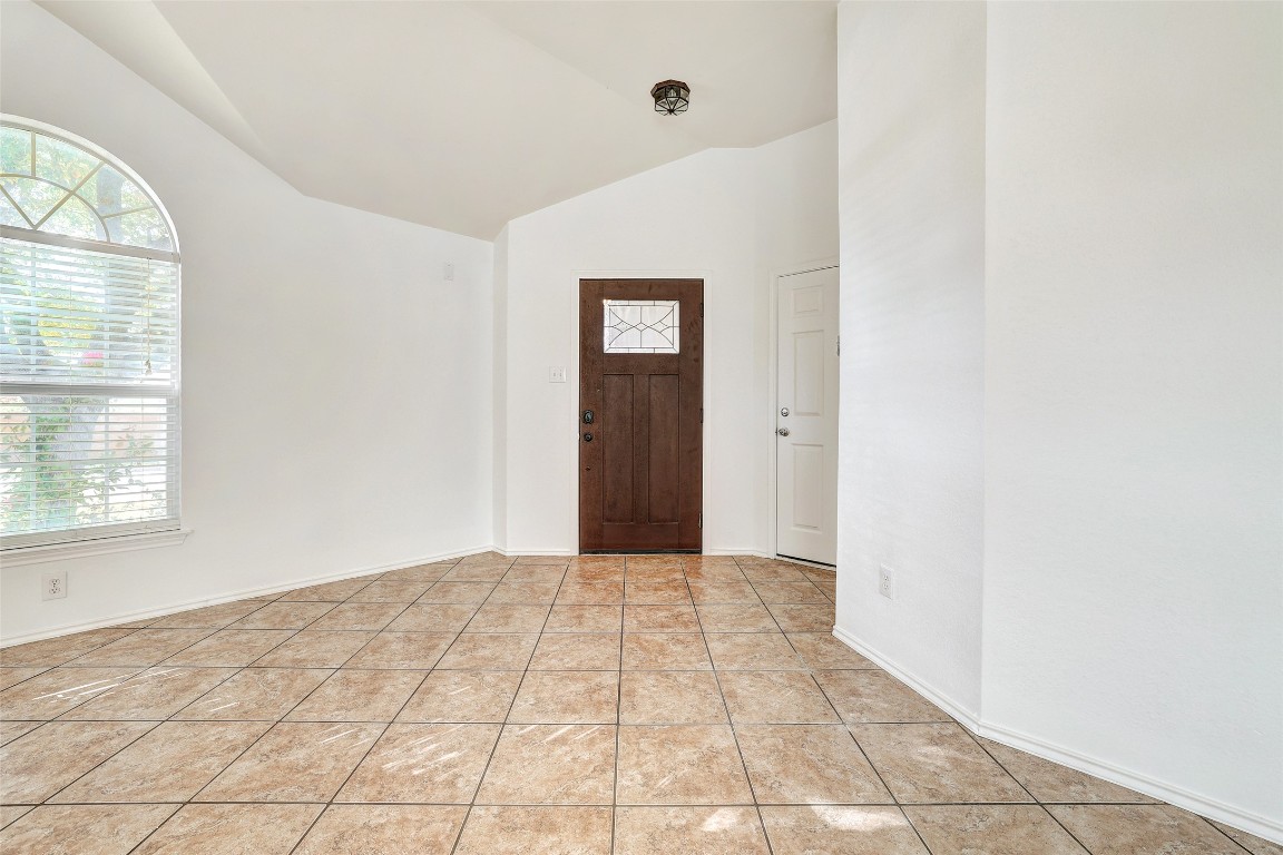 1517 Rainbow Parke Drive Round Rock, TX 78665 - Photo 5 of 38 an empty room with windows