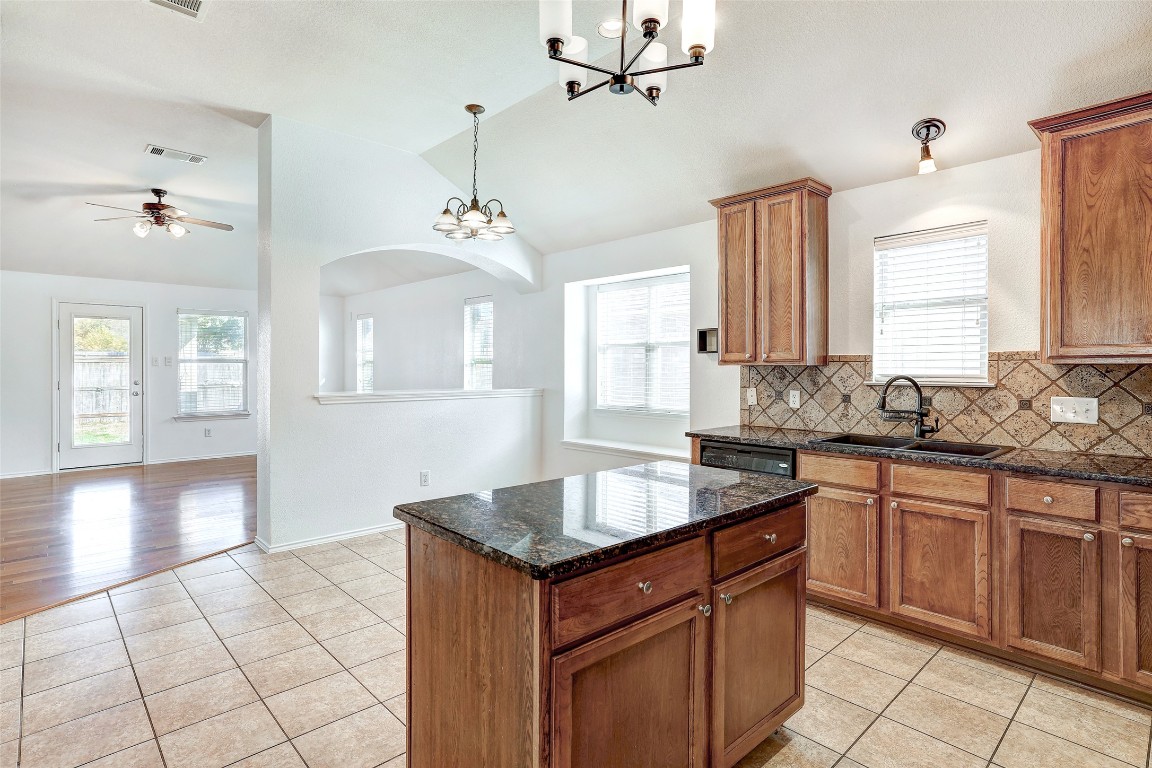 1517 Rainbow Parke Drive Round Rock, TX 78665 - Photo 10 of 38 a kitchen with a sink stove and cabinets