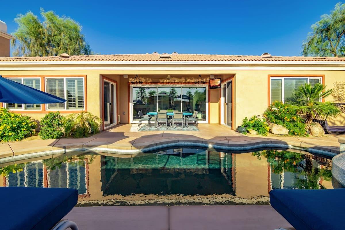 43875 Spiaggia Place Indio, CA 92203 - Photo 3 of 52 a front view of a house with garden
