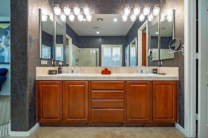 43875 Spiaggia Place Indio, CA 92203 - Photo 34 of 52 a bathroom with a double vanity sink mirror and window