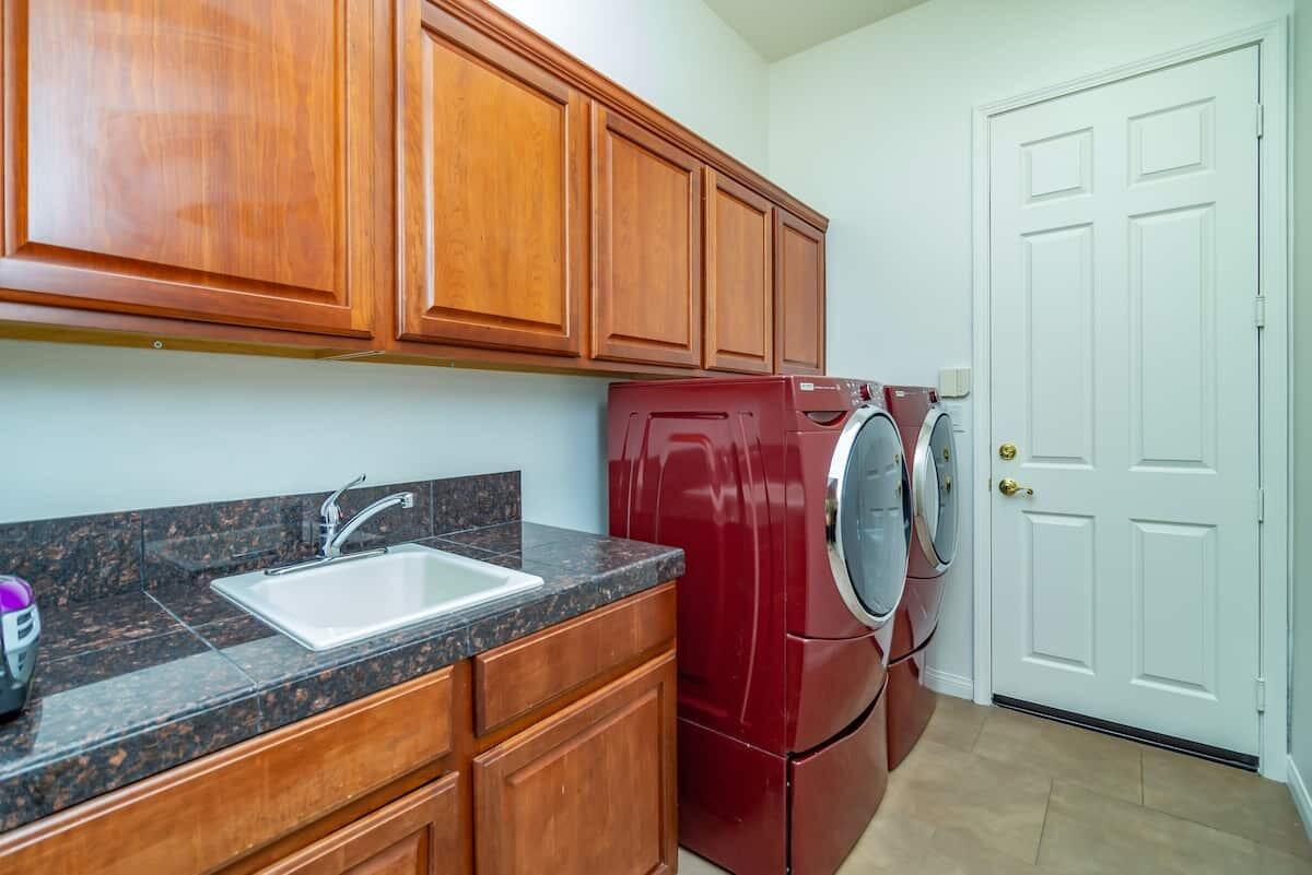 43875 Spiaggia Place Indio, CA 92203 - Photo 43 of 52 a kitchen with stainless steel appliances granite countertop a sink and cabinets
