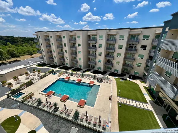 a view of swimming pool outdoor seating