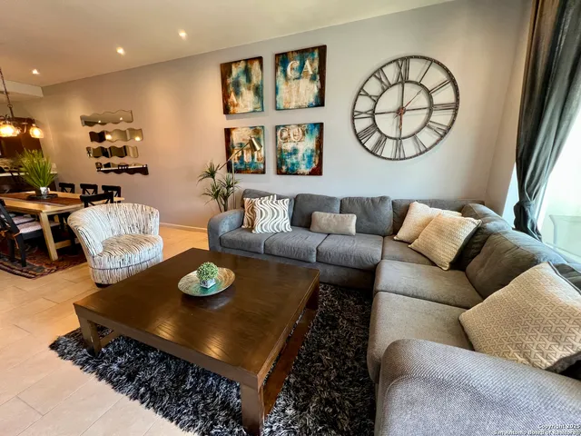 a living room with furniture and a table