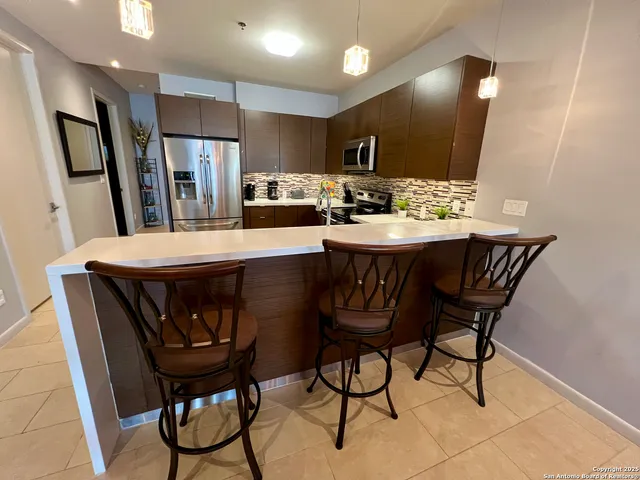 a view of a dining room with furniture
