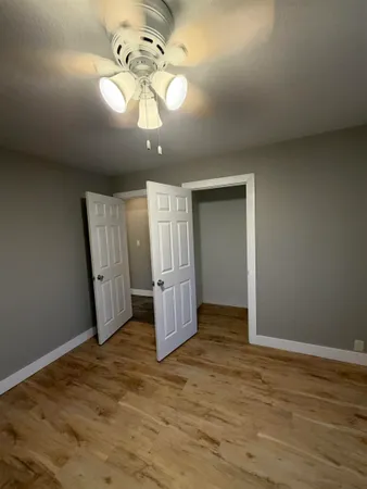 a bathroom with a sink toilet and mirror