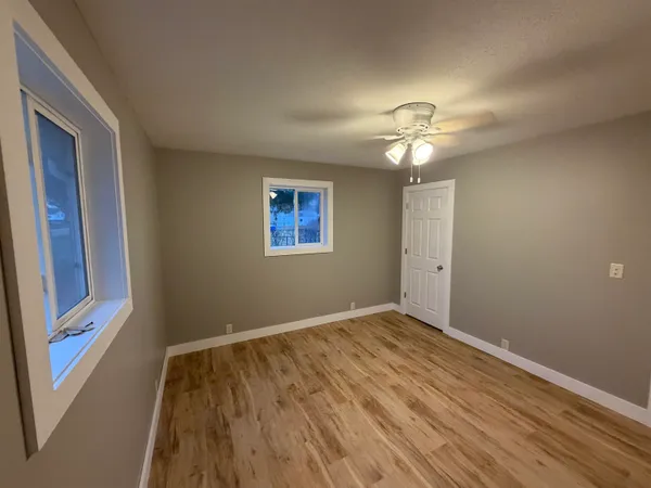 a view of a livingroom with wooden floor