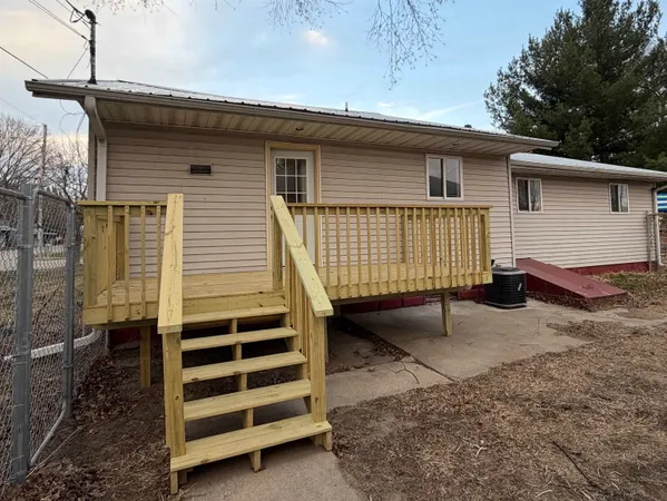 a view of a house with a yard and garage