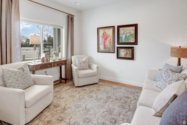 910 South 1700 West Layton, UT 84041 - Photo 3 of 26 Living area featuring baseboards and wood finished floors
