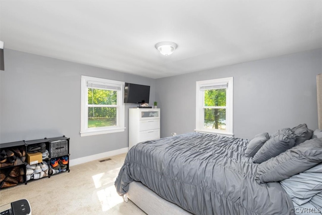 4101 Courthouse Road Chesterfield, VA 23236 - Photo 14 of 30 a bed sitting in a bedroom next to a window