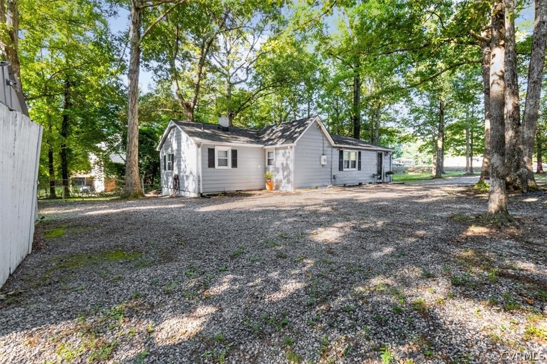 4101 Courthouse Road Chesterfield, VA 23236 - Photo 22 of 30 a front view of a house with a yard and large trees