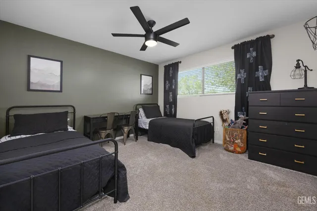 a view of a lake with lawn chairs