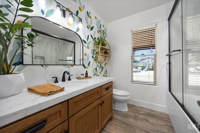 a view of a swimming pool with a lawn chairs and plants