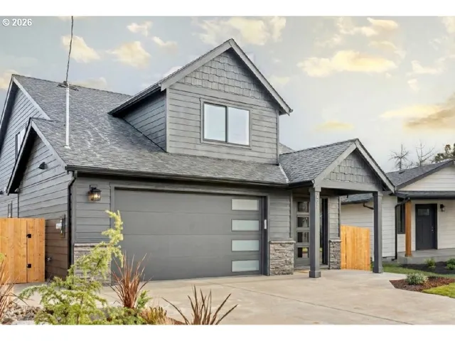 a front view of a house with a garage