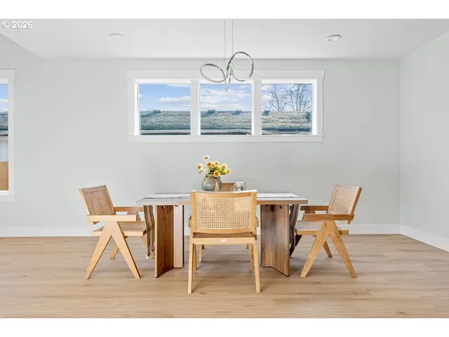 a view of dining room and wooden floor